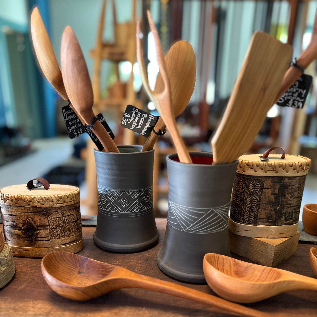 Ceramic utensil holders and hand carved wooden spoons and spatulas
