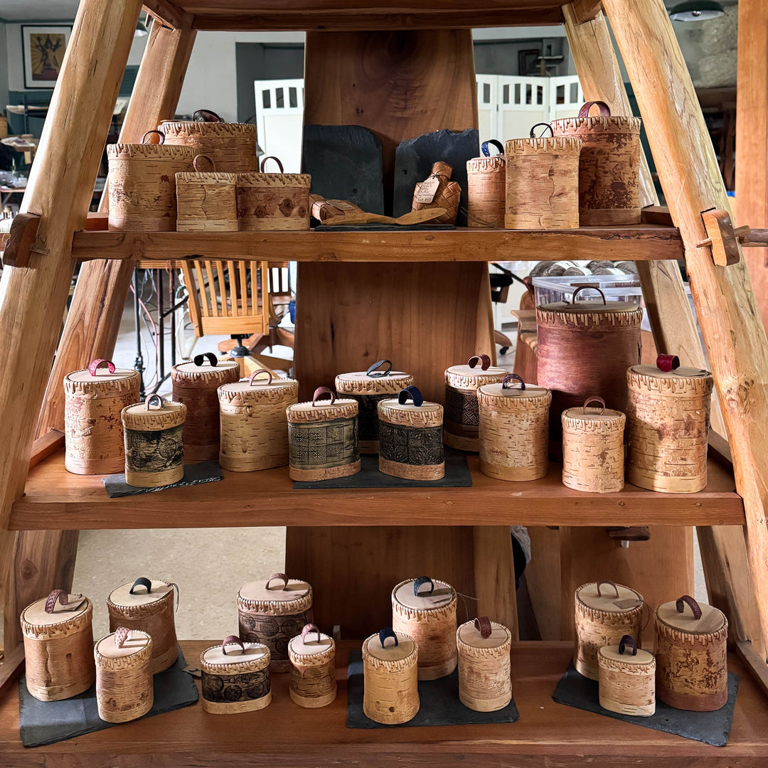 Handmade birch storage boxes in shop display